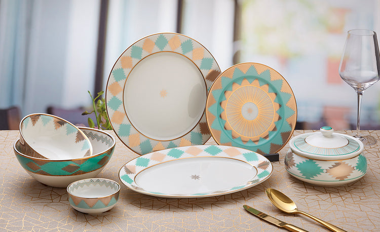 A 22-piece porcelain dinner set featuring a soothing teal color palette with modern geometric designs, adding a subtle warmth to your dining table