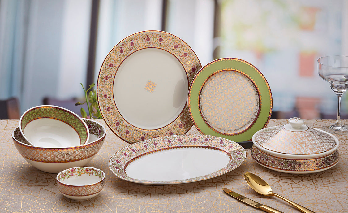 22 pieces Nur Collection premium dinner set , featuring 24-carat gold accents and elegant floral green stem patterns.