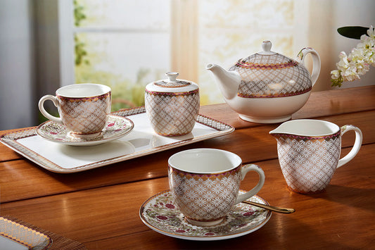 A 16 pcs premium tea set featuring 24-carat gold accents and elegant floral green stem patterns.